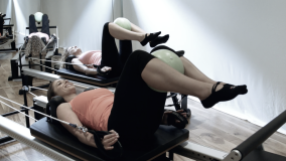 Working lats and inner thighs at the Peacock Pilates Reformer Studio in Central London